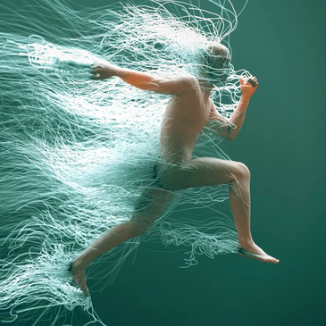 A dynamic figure running with flowing, ethereal light trails.