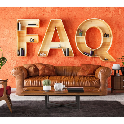 Cozy living room with FAQ-shaped wooden shelves on an orange textured wall.