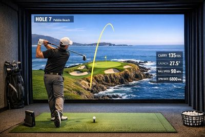 A golfer hitting a simulator shot onto the 7th at Pebble Beach