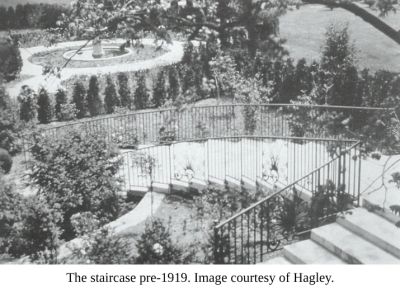 Pre-1919 outdoor staircase surrounded by garden.