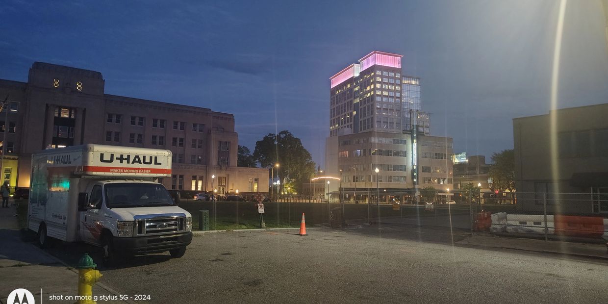 Norfolk Movers U-Haul truck parked in downtown Norfolk at dusk on April 13, 2026 — veteran-owned sam