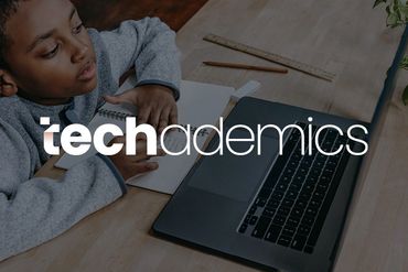 Boy learning and doing school work on a computer. Techademics logo.