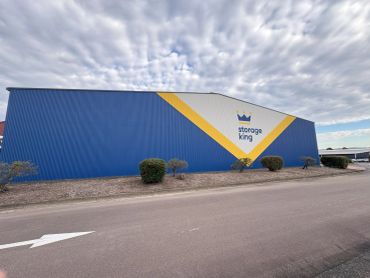 Storage King building with blue and yellow design.