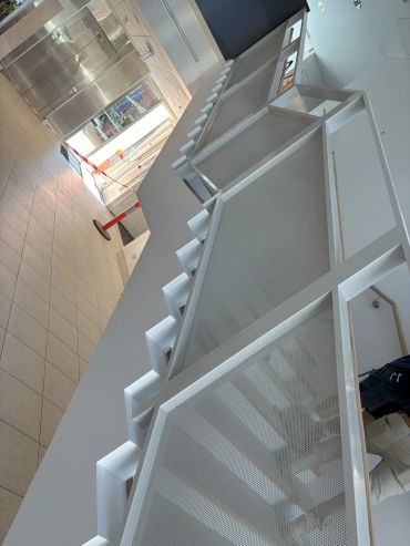 Indoor view of an elevator area with maintenance work in progress.