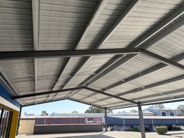 Industrial metal ceiling with large beams.