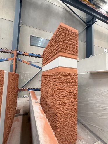 Decorative textured corner brick wall indoors.