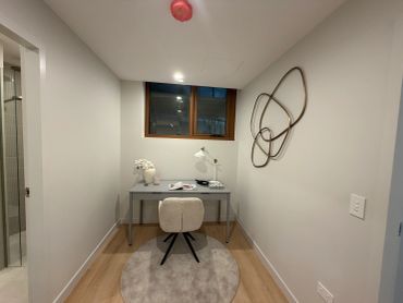 Small minimalist desk setup in a cozy room.