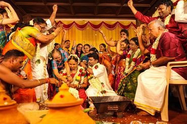 Family blessing bride and groom at traditional Tamil wedding in Thanjavur by Luster Pearl Media.