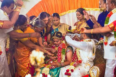 Family blessing during traditional Tamil wedding muhurtham in Thanjavur by Luster Pearl Media.