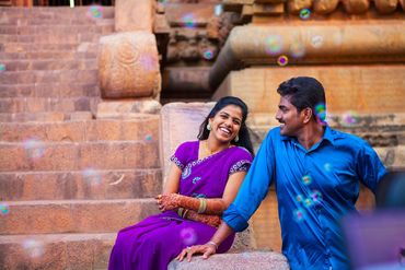 Happy couple at heritage pre-wedding shoot with bubbles in Karaikudi by Luster Pearl Media.