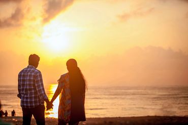 Romantic couple at sunset beach pre-wedding shoot in Thanjavur by Luster Pearl Media.