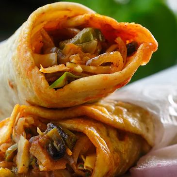 WAH KATHI ROLLS - Kathi rolls are a popular Indian street food  wraps with a filling of protein, often made with Paneer, Chicken, egg, and coriander chutney.