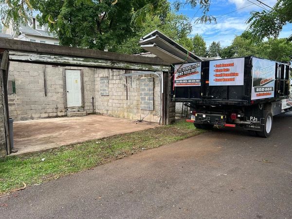 Garage cleanout and junk removal on a residential property.