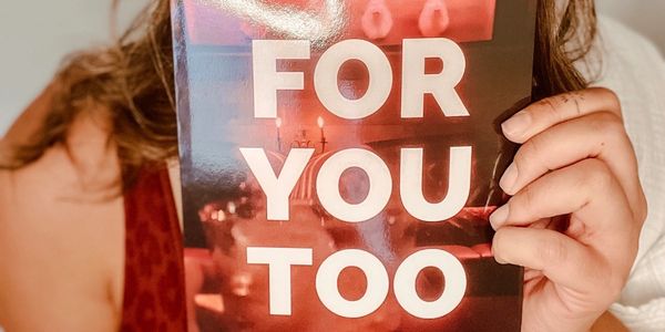 Person holding a card with 'FOR YOU TOO' text.