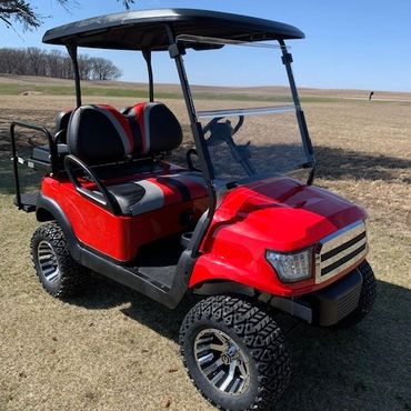 red lifted golf cart