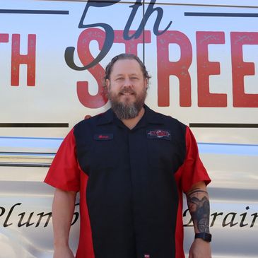 plumber mark headshot in front of van