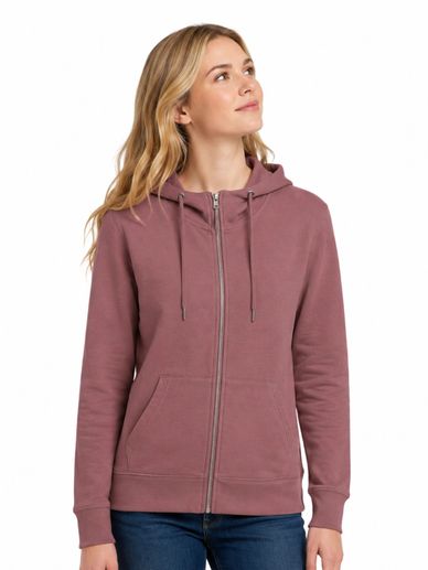Woman wearing a mauve zip-up hoodie with pockets and a hood.