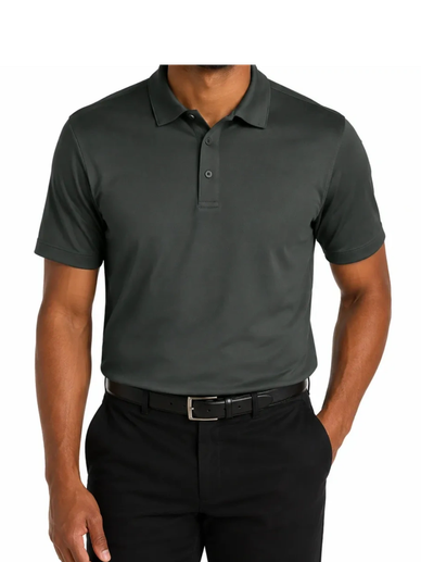 Smiling man wearing a dark green polo shirt and black pants.