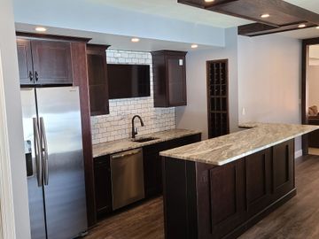 Finished basement bar with built in wine rack