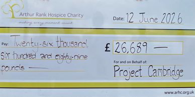Charity cheque for £26,689 to Project Cambridge from Arthur Rank Hospice Charity.