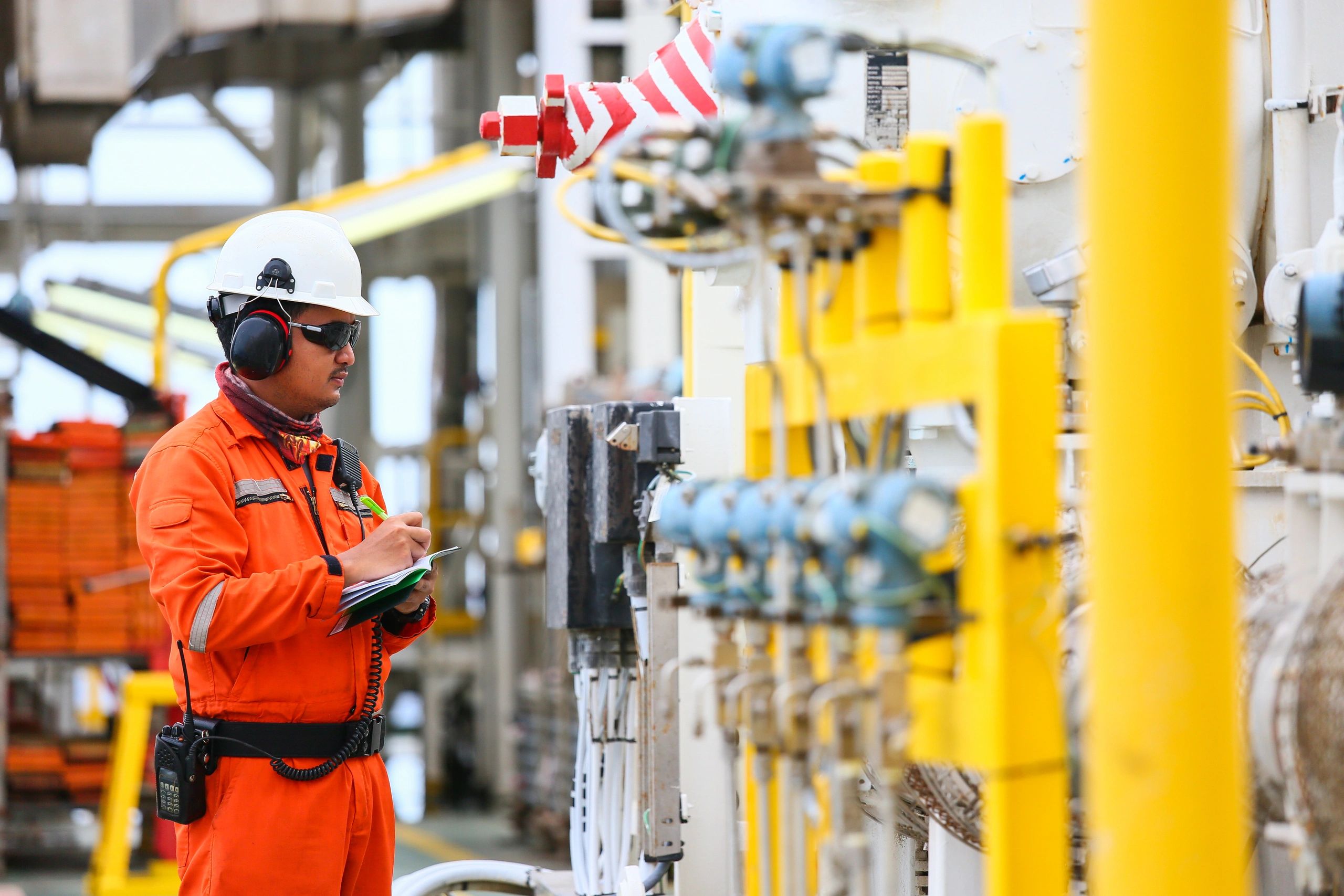 offshore platform operator inspecting plant