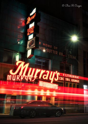 Murray's Restaurant in Minneapolis, Minnesota. MN. Neon lights and light streaks from passing cars.