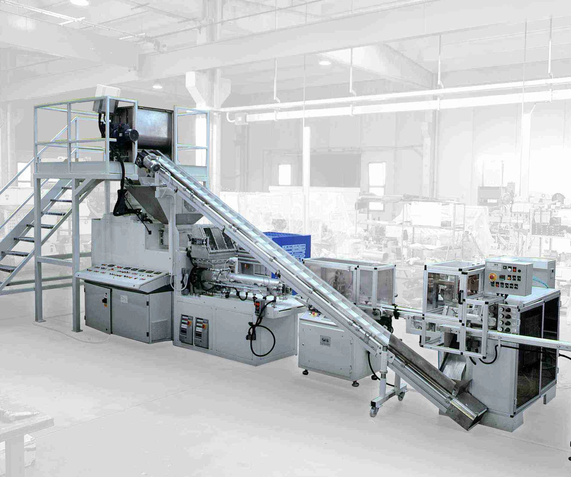 Automated industrial machinery with conveyor belts in a clean factory setting.