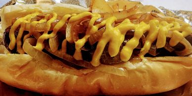 Premium Photo  A hot dog with onions and mustard on it