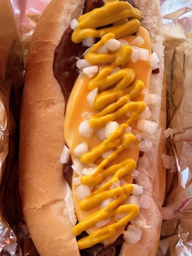 Premium Photo  A hot dog with onions and mustard on it