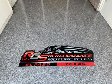 Logo decal on floor of RS Performance Motorcycles in El Paso, Texas.
