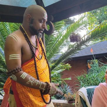 Marquan Moorehead conversing with a devotee at the Kauai's Hindu Monastery in Wailua Homesteads, HI.