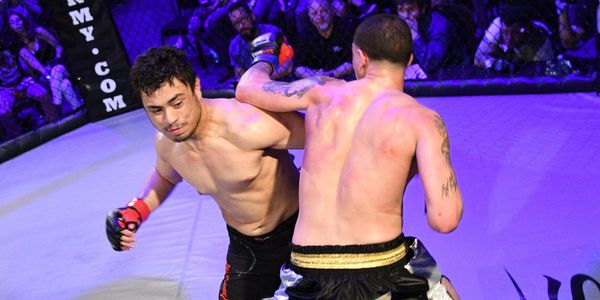 Josh Sachetti slips a punch in MMA competition