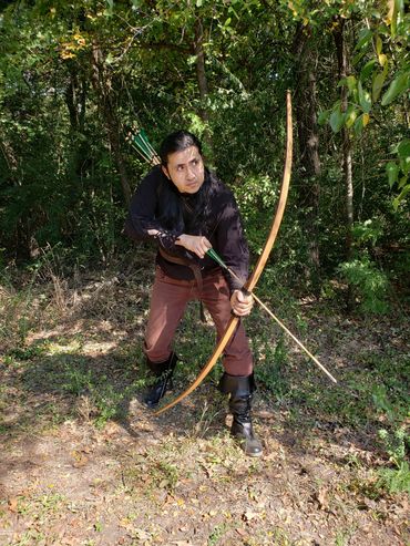 Nateriel of the Dark Forest from Medieval/Fantasy Folk/Rock band Elflore hunting with a bow.