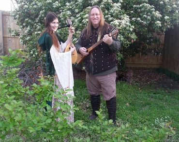 Heather and Frank from Medieval/Fantasy Folk/Rock band Elflore by a tree.