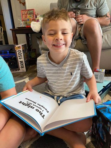 One of Jasper's little fans enjoying his childrens picture book "The night I spent in a people house