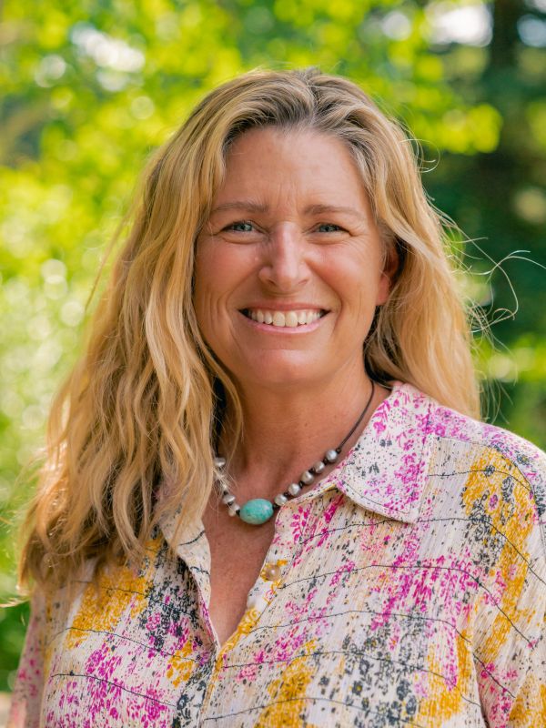 Vibrant, smiling image of author Bridget Crocker. Photo: Liz Fisher
