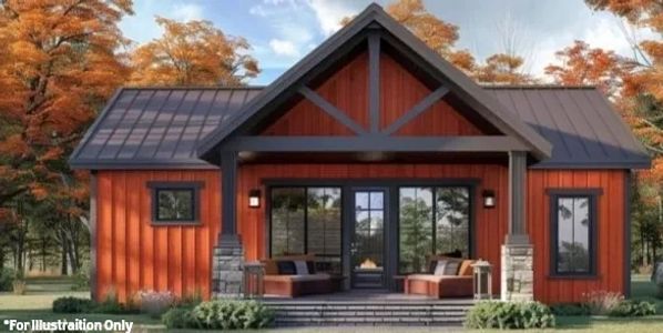 Cozy modern cabin with orange siding and dark roof in autumn setting.