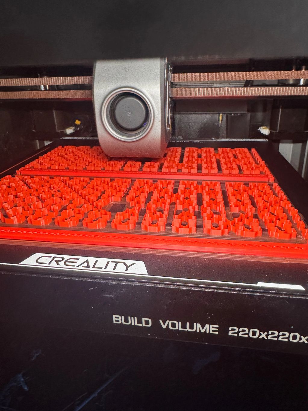 3D Printer Printing support material that supports the parts overhangs.