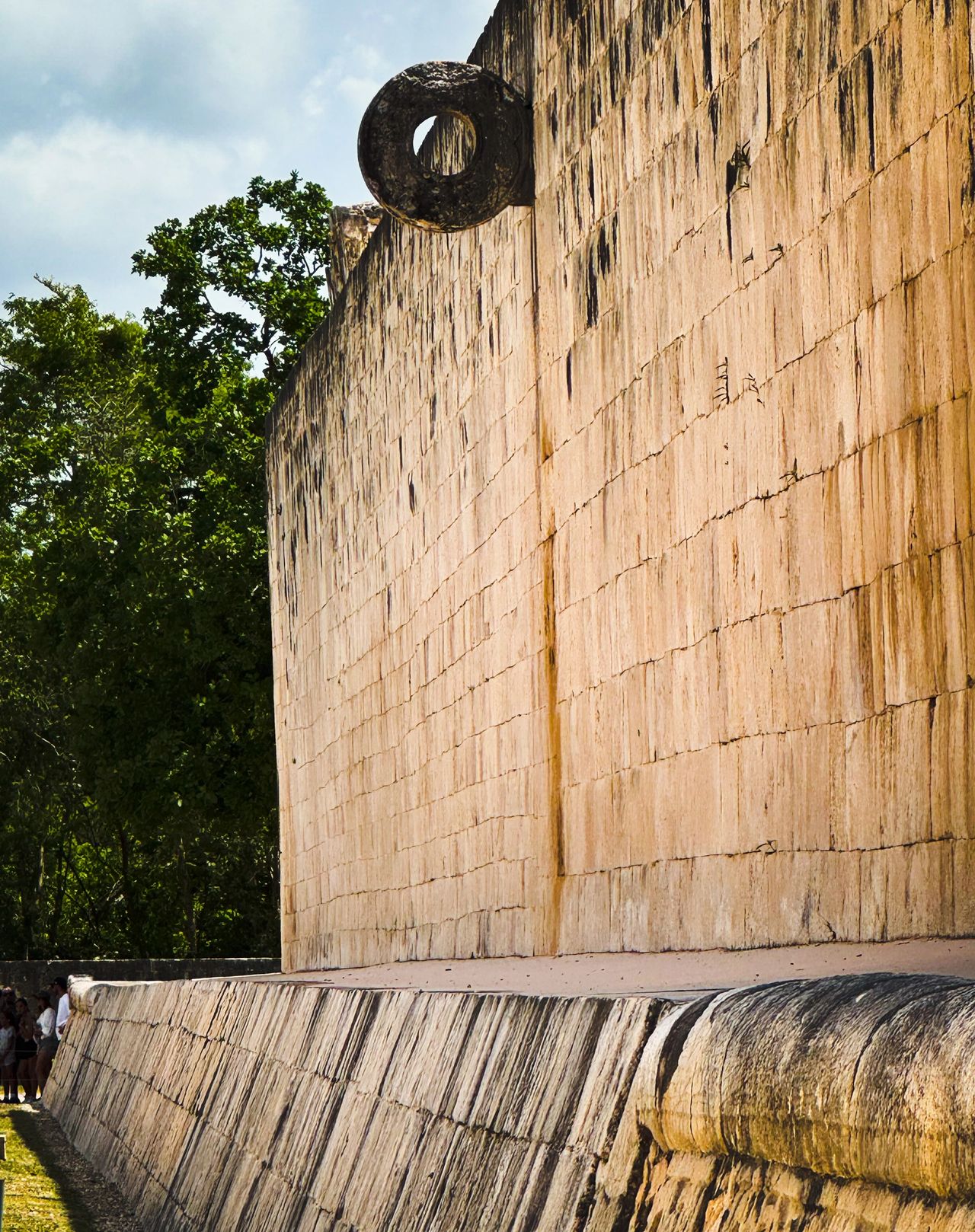 An image of one of two sideways stone hoops on the court