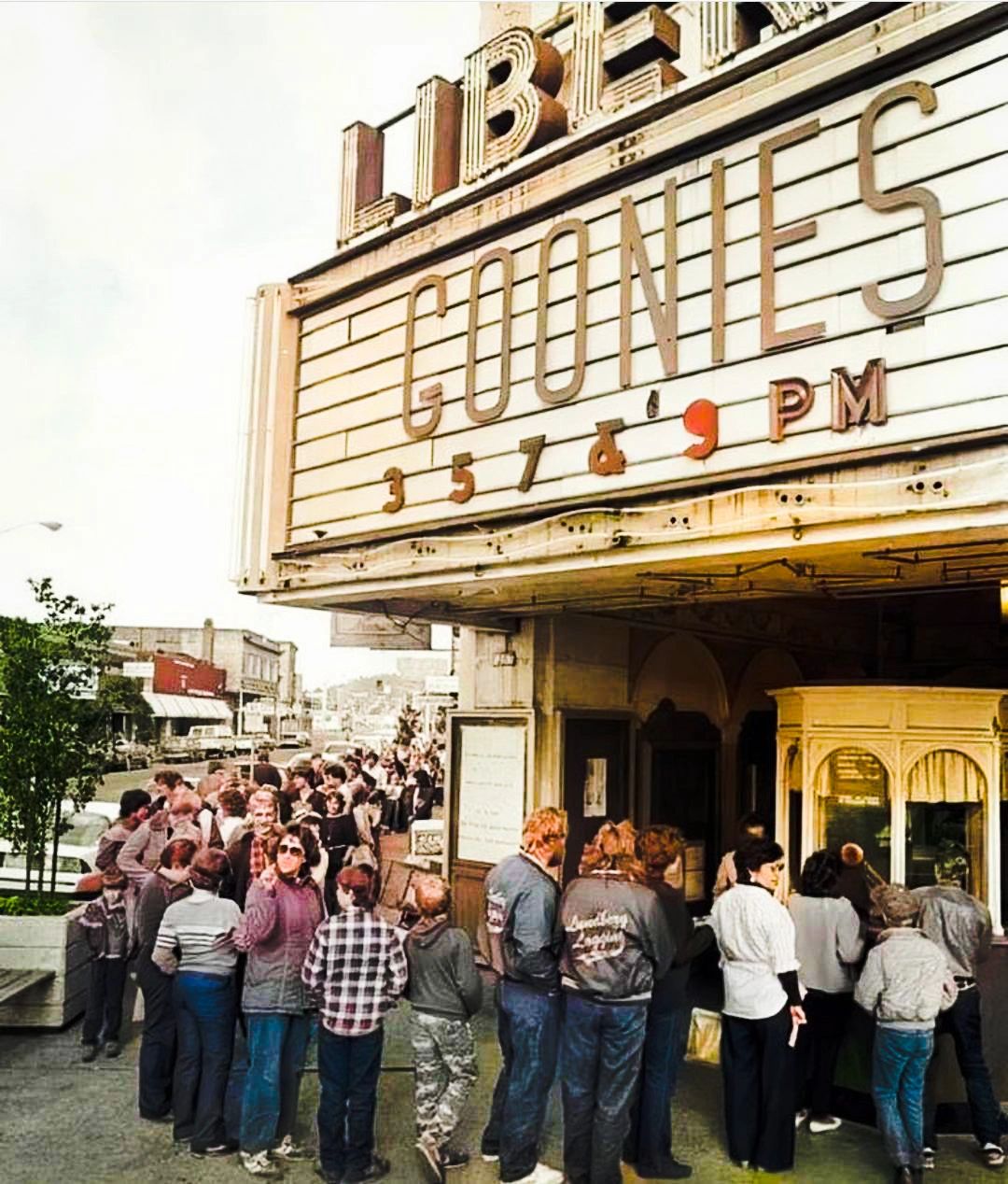 Screenshot of people waiting around the block to see "The Goonies"