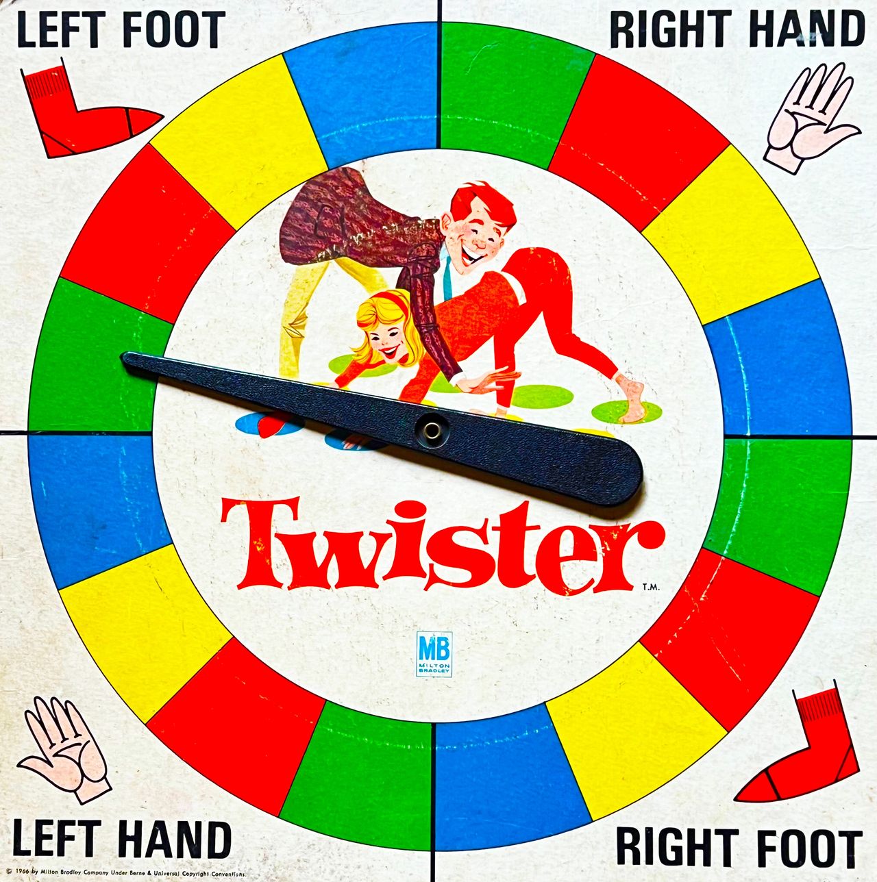 The spinner for the physical-skill game of "Twister," produced by Milton Bradley Company