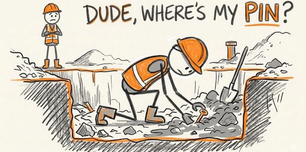 A worker searches for a lost pin at a construction site.