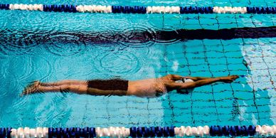 Streamlined swimmer in a swimming lane. Photo by Richard R. Schünemann on Unsplash
  