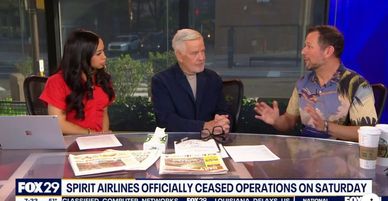 Three people discussing news on a TV show.