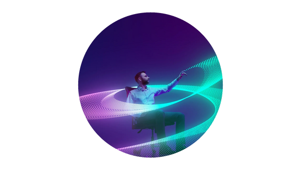 Man sitting on chair interacting with glowing digital wave patterns.