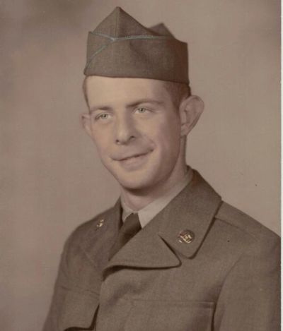 Portrait of a young soldier in uniform and cap.