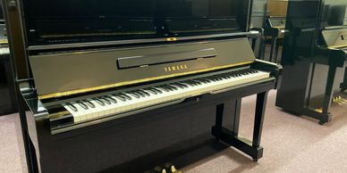 Several rebuilt & refinished high-polish ebony Yamaha & Kawai upright pianos