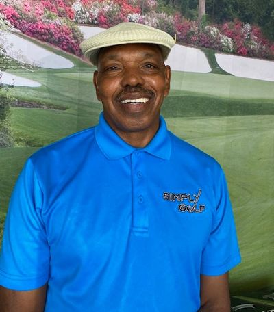 A. Lee Wilson in a blue color t-shirt with simply golf logo 