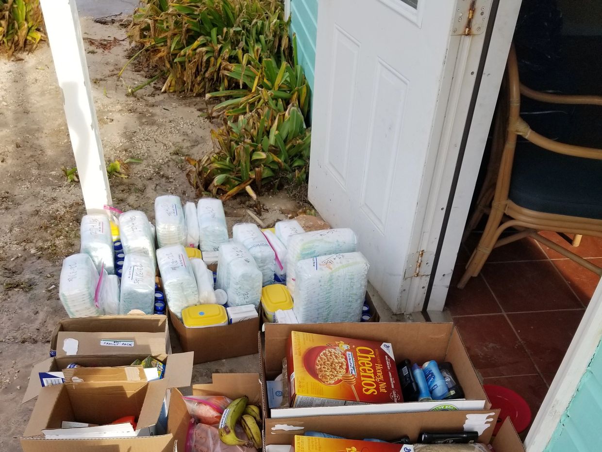 A scenic landscape featuring mountains, a lake, and a vibrant sunset.