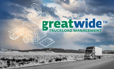 Truck on highway with Greatwide Truckload Management logo and graphics.